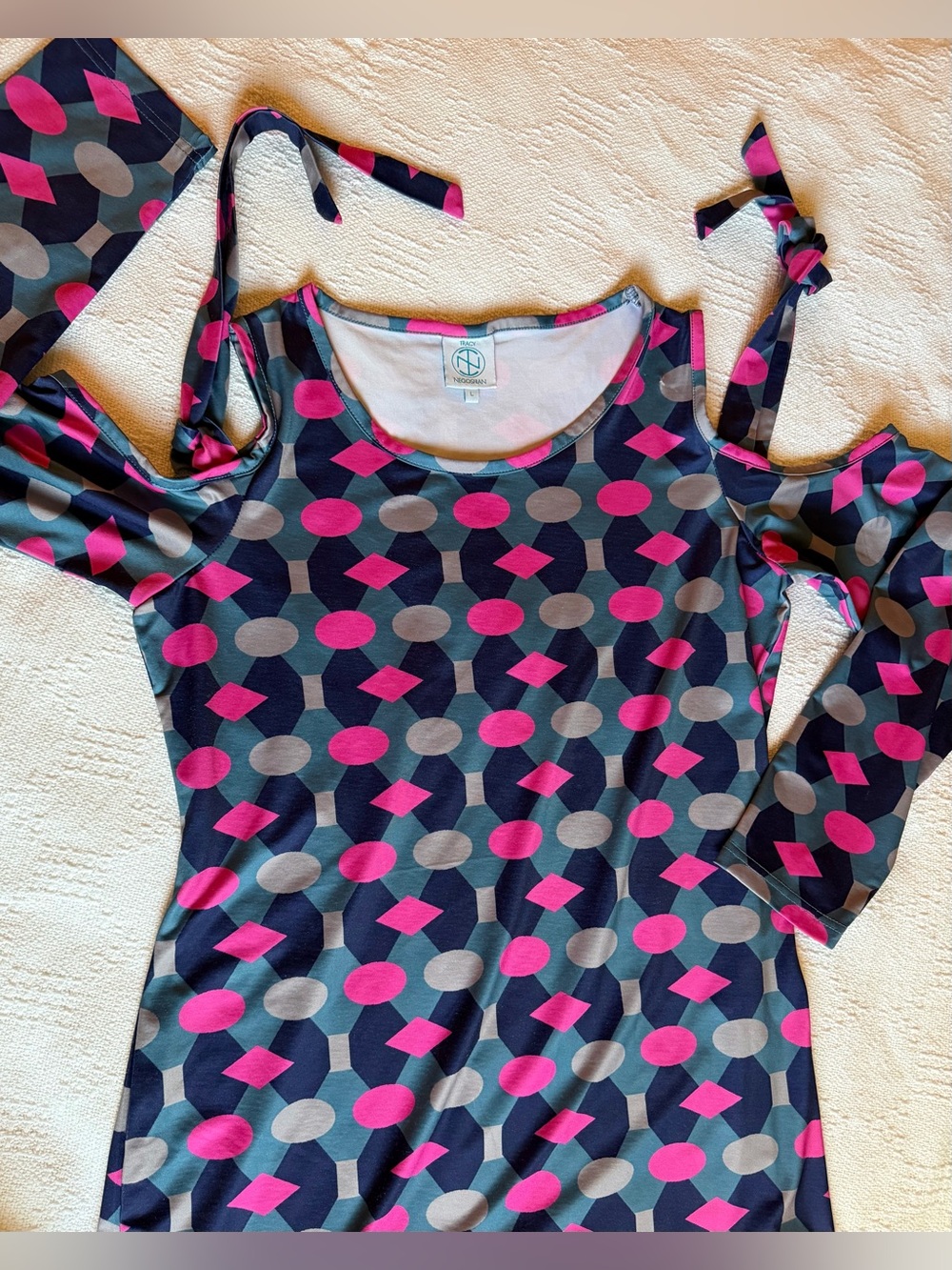 Tracy Negoshian colorful dress with cold shoulder ties and graphic color design.